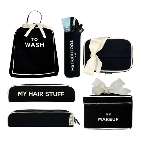Bag-all Deal Gift Set featuring black cotton travel organizers: To Wash laundry bag, Hairstuff case, Toothbrush holder, and Makeup box with white ribbon accents and protective linings