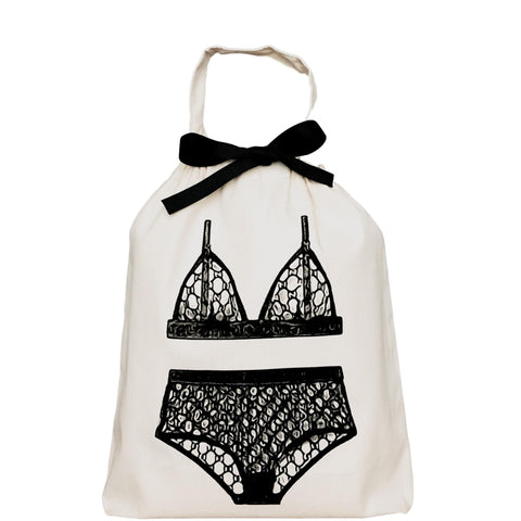 Bag-all London Lingerie Travel Bag in cream cotton with black lingerie illustration and bow, featuring elegant bralette and underwear design for stylish organization