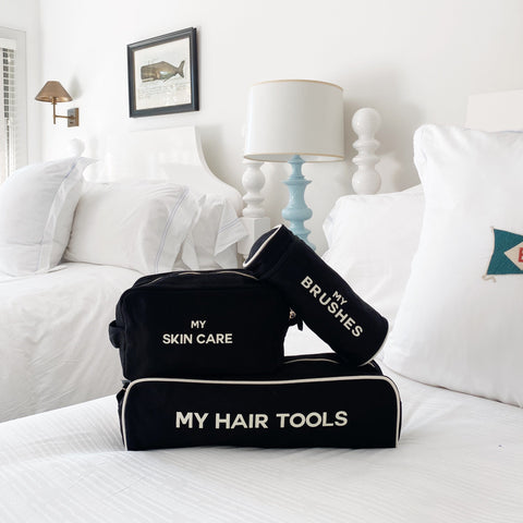 Bag-all Pamper Gift Set Deal 3-Pack Black featuring organized beauty storage with hair tools case, brushes case, and skincare pouch in sleek black cotton with white text labeling