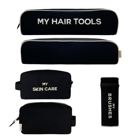Bag-all Pamper Gift Set 3-Pack featuring black cotton organizers: Hair Tools case, Brushes holder, and Skin Care pouch with white text labeling for beauty essentials storage
