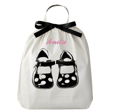Bag-all Children Shoe Bag in cream cotton featuring black polka dot shoe design, decorative black bow, and hanging loop - perfect storage solution for kids footwear