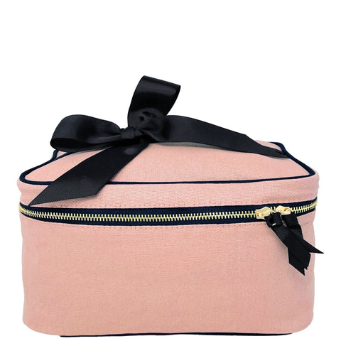 Bag-all Medium Box Makeup & Toiletry in blush pink cotton with black bow, gold zipper, and striped interior lining for travel organization and beauty storage