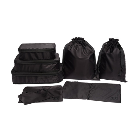 Bag-all Compression Cubes & Packing Bags Set in black recycled nylon featuring 8 pieces: 3 compression cubes, 2 packing cases, and 3 drawstring bags for efficient travel organization