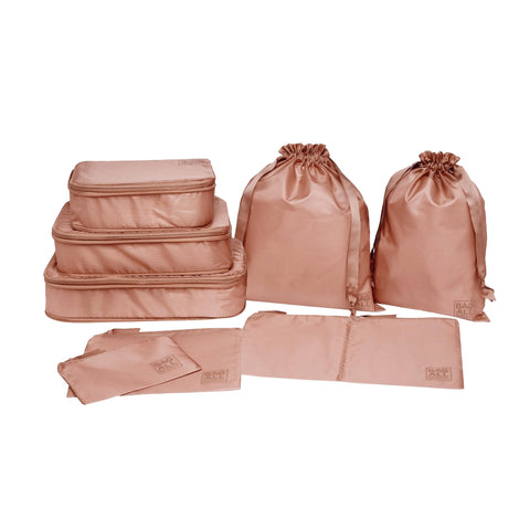 Bag-all Compression Cubes & Packing Bags Set in pink blush featuring 8 eco-friendly recycled nylon organizers with compression technology for efficient travel packing and storage