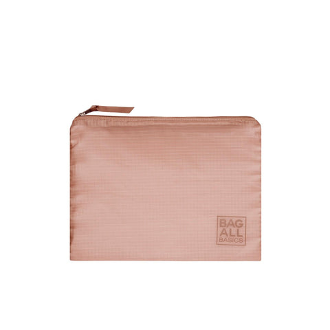 Bag-all Pink Recycled Nylon Packing Bag with zip closure, part of 5-pack travel organizer set, featuring embossed logo and sustainable design
