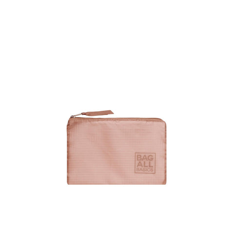 Bag-all recycled nylon packing bag in blush pink with logo, part of 5-pack organizing set, featuring durable zipper closure and eco-friendly construction