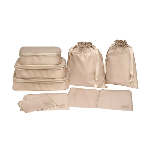 Bag-all Compression Cubes & Packing Bags Set in taupe featuring 8 recycled nylon organizers with compression technology. Three cube sizes, packing cases, and bags for efficient travel storage.