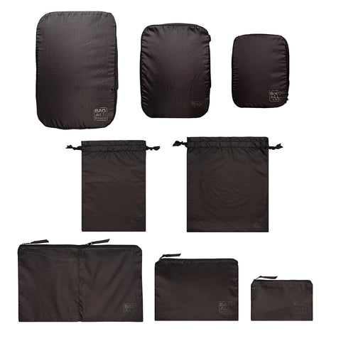 Bag-all Compression Cubes & Packing Bags Set featuring 8 black organizers in various sizes, made from recycled nylon, ideal for efficient travel packing and organization