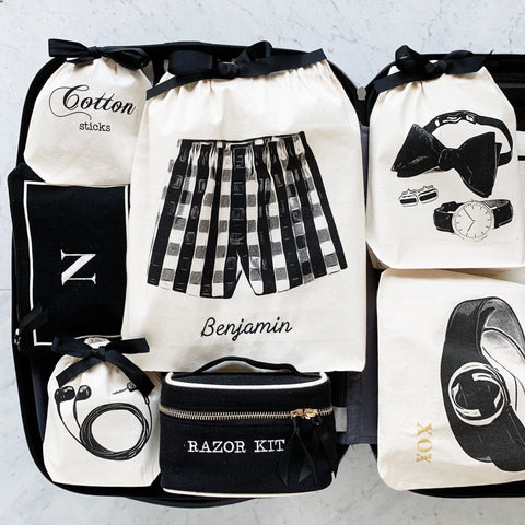 Bag-all Boxer Shorts Bag in cream cotton featuring black drawstring and stylish underwear graphic print, perfect for travel organization and drawer storage