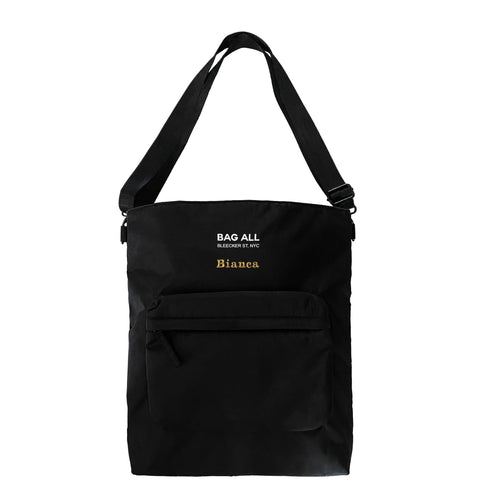 Bag-all City Backpack/Tote in black recycled nylon features convertible straps, padded laptop compartment, front zip pocket and striped interior lining for versatile urban use