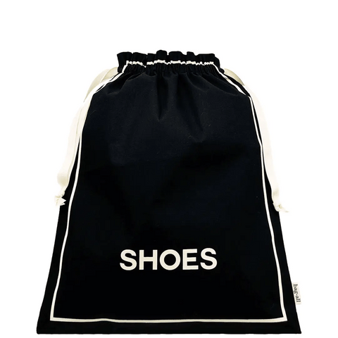 Bag-all Couture Shoe Travel Bag in black cotton with white drawstring closure and SHOES text print, perfect for organized footwear storage and travel