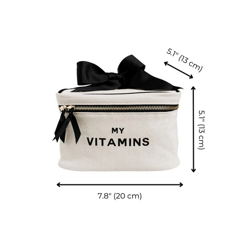 Bag-all Vitamins Storage and Travel Box in cream with black bow accent, featuring 'MY VITAMINS' text, black zipper, and dimensions 7.8x5.1x5.7 inches, perfect for organizing supplements