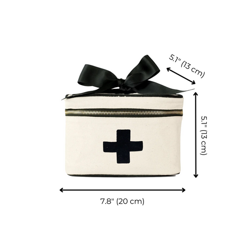 Bag-all Meds and First Aid Storage Box in cream cotton with black cross design, black bow accent, and zipper closure, showing product dimensions 7.8x5.1x5.1 inches