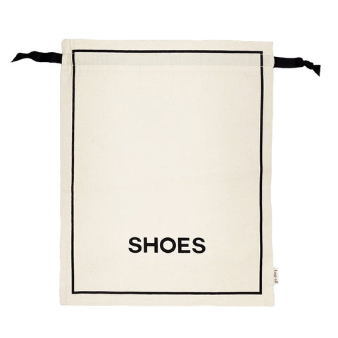Bag-all Couture Shoe Travel Bag in cream canvas with black border and 'SHOES' text print, featuring drawstring closure for elegant footwear organization