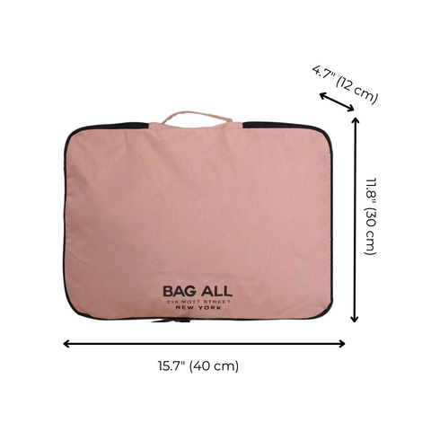 Bag-all Large Double Sided Packing Cube in blush pink with black trim and handle, featuring three compartments and measurement details: 15.7" width, 11.8" height, 4.7" depth