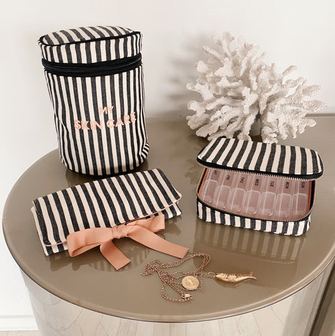 Bag-all Essential Gift Set Deal 3-Pack featuring striped cotton organizers - round skincare case, pill case, and jewelry roll pouch in classic black and white stripes with coral bow accents