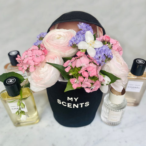 Bag-all Round My Scents Case in black with pink and purple flowers, displaying perfume bottles, perfect for organizing fragrances, stylish storage solution