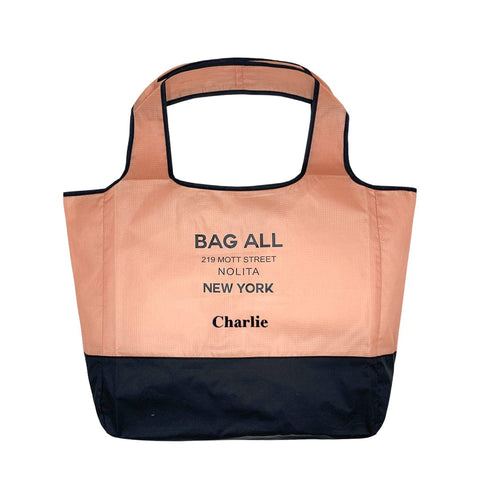Bag-all Folding Shopping Bag with Zipper Pocket Pouch in pink and black nylon, featuring two-tone design with brand address details and personalized name, perfect for eco-friendly shopping