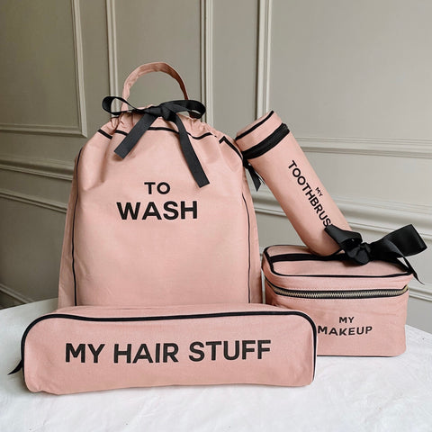 Bag-all Deal Gift Set featuring blush pink cotton travel organizers: To Wash laundry bag, makeup box, hair stuff case, and toothbrush holder with black text and bows