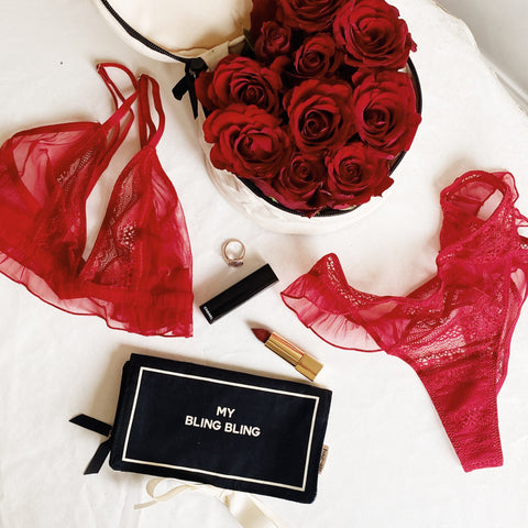 Bag-all Black Jewelry Organizer Travel Pouch with three compartments styled with red roses, lingerie, and lipstick - elegant storage solution for rings, earrings, and accessories