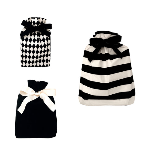 Bag-all Gift Bags Set Mix 1 featuring black and white reusable fabric bags with diamond, solid, and striped patterns, adorned with elegant ribbon bows in various sizes
