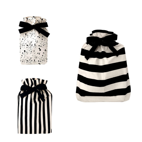 Bag-all Gift Bags Set Mix 2: Three reusable fabric bags featuring black and white designs - splatter pattern small bag and striped medium and large bags, each with elegant black bow closure