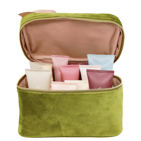 Bag-all My Makeup Cosmetic Box in luxurious green velvet, featuring waterproof interior and organized compartments displaying assorted beauty products and skincare tubes