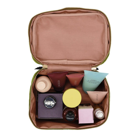 Bag-all My Makeup Cosmetic Box in Green Velvet, opened to display organized beauty products in compartments with blush interior lining and gold zipper trim, waterproof storage solution