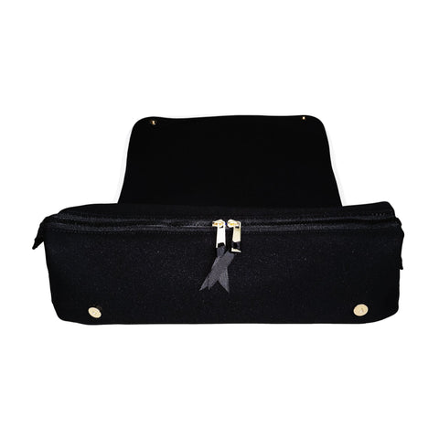 Black hair tools travel case with zipper, heat-resistant mat, and gold-tone hardware for safe styling tool storage.