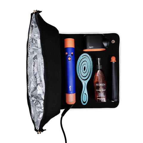 Black hair tools travel case with heat-resistant mat, holding curling wand, hairbrush, spray bottle, and attachments organized