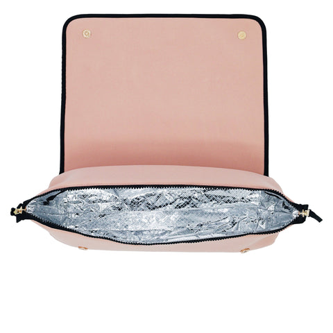 Open pink travel case with heat-resistant silver lining designed for hair styling tools and accessories storage