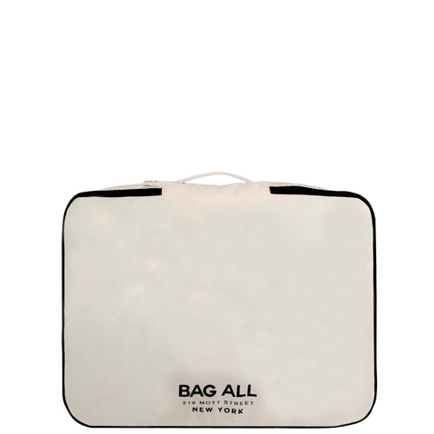 Bag-all Large Double Sided Packing Cube in cream with black trim, featuring dual compartments and shoe storage space. Premium travel organizer with logo detail.