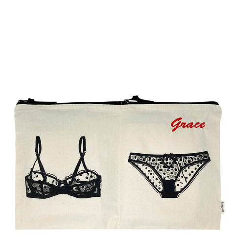 Bag-all Double Lingerie Packing Pouch in cream cotton featuring black illustrated bra and panty design, dual compartments with zipper closure, ideal for travel organization