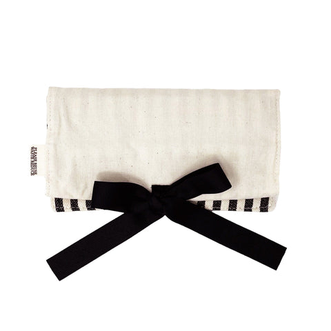Bag-all Jewelry Organizer Travel Pouch in cream cotton with black bow, striped interior, multiple compartments for rings and earrings, perfect for storage and travel