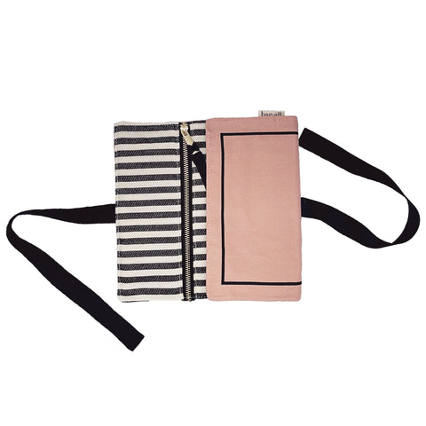 Bag-all Couture Jewelry Roll Medium in pink with striped lining, featuring multiple zipper compartments and black straps for elegant jewelry organization and travel storage