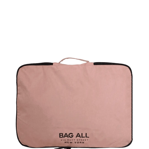 Bag-all Large Double Sided Packing Cube in blush pink with black trim, featuring multiple compartments and carrying handle for organized travel storage