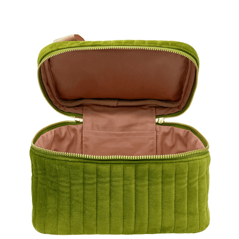 Open quilted green velvet makeup cosmetic box with soft pink interior lining and zipper closure