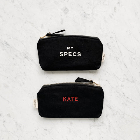 Bag-all Specs Glasses Case Black with personalization option, featuring white and red text on durable cotton canvas, zipper closure, compact protective design