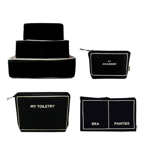 Black personalized weekend packing set with labeled cotton cubes and pouches for charger, toiletry, bra, and panties.