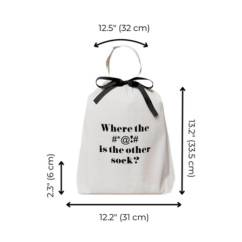 Bag-all Where Sock Bag in cream cotton with black bow and humorous text print, perfect for organizing mismatched socks. Measures 12.5x13.2 inches.