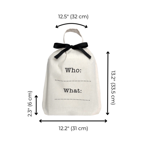 Bag-all Who What Bag in cream cotton with black bow, featuring customizable text fields and measurements 32x31cm, perfect for personalized organization