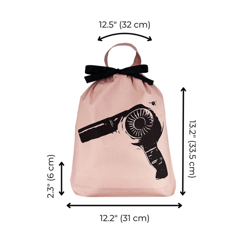 Bag-all Hair Dryer Travel Bag in pink with black bow handle and hairdryer graphic print, featuring drawstring closure and dimensions 32x31cm - perfect for organizing styling tools
