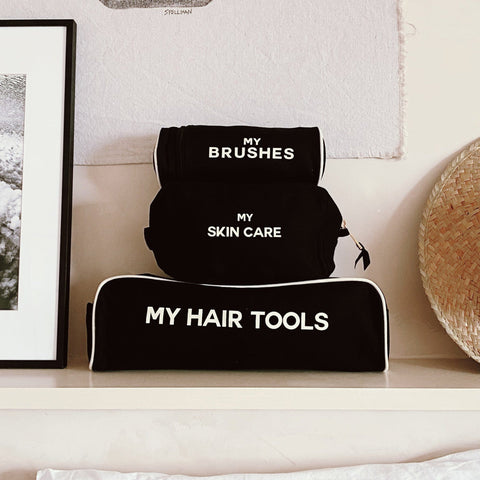 Bag-all Black Pamper Gift Set 3-Pack featuring organized beauty storage with My Hair Tools, My Brushes, and My Skin Care cases in sleek black cotton with white text