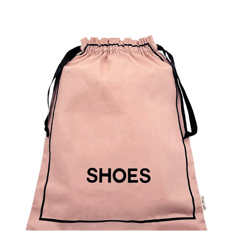 Bag-all Couture Shoe Travel Bag in blush pink with black drawstring closure and 'SHOES' text, perfect for organized footwear storage and travel