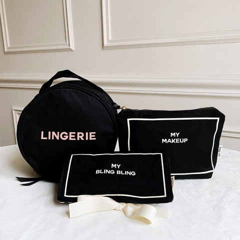 Bag-all Deal Gift Set for Her: Black cotton travel organizers featuring Round Lingerie Case, Jewelry Case, and Makeup Case with elegant white text labels and striped interior lining