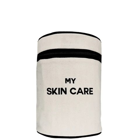 Bag-all Round My Skin Care Case in cream - cylindrical organizer with black trim, waterproof lining and internal pockets for organized skincare storage