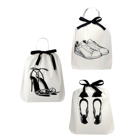 Bag-all Shoe Bags Set 3-pack Cream featuring illustrated sneakers, high heels, and ballet flats on cotton drawstring bags with black ribbon ties, perfect for travel organization