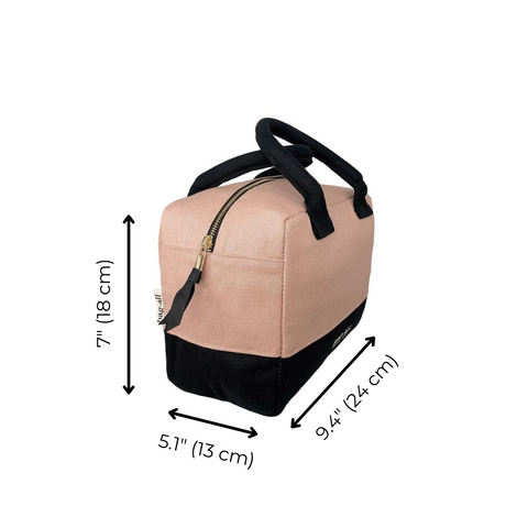 Bag-all Stylish Monogram Lunch Box in pink/blush with black trim, featuring insulated design, gold zipper, and padded handles. Dimensions: 7" x 5.1" x 9.4