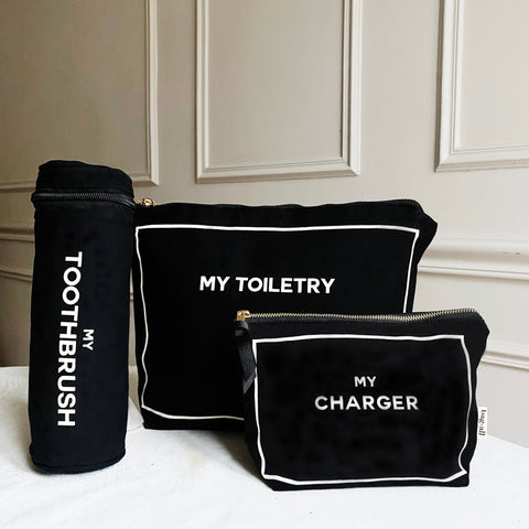 Bag-all Best Deal Gift Set featuring black cotton cases for toothbrush, toiletry, and charger with white piping and text, perfect for stylish travel organization