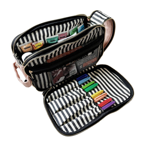 Pink blush triple travel organizer open showing striped compartments with colored markers and small items inside mesh pockets